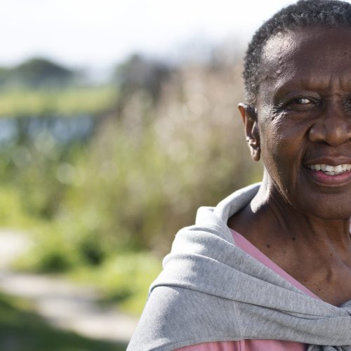 medium-shot-smiley-black-woman-outside